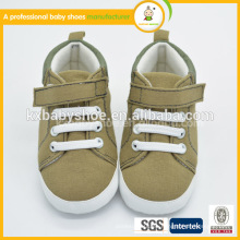 La suela suave del niño infantil lindo del niño de la niña calza los zapatos de bebé de la venta al por mayor de la lona de la zapatilla de deporte